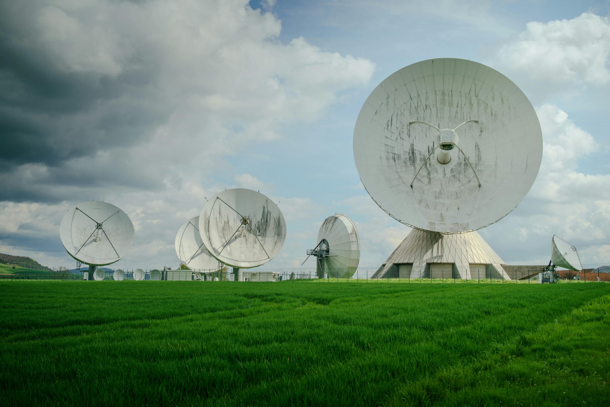 Ground station antennas and satellite communication infrastructure sunset