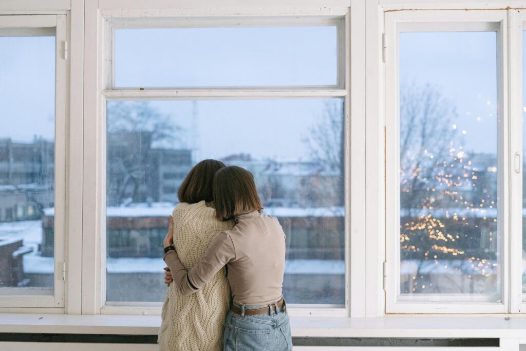 People hugging warm light mental health